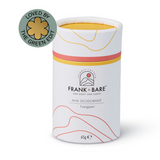 A cylindrical stick deodorant with a white base and yellow and red accents, labeled 'FRANK + BARE AHA Deodorant Frangipani', with a badge stating 'loved by THE GREEN EDIT'. The packaging indicates the product is eco-friendly and 65g in weight.
